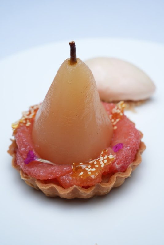 pear frangipane tart with tahini, grapefruit, ginger, and rose